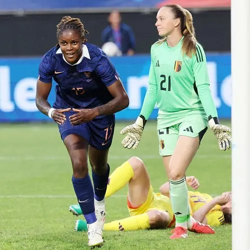 France's forward #15 Kelly Gago (L) celebrates scoring her team's first goal during the women's friendly football match between France and Belgium at the Stade du Hainaut in Valenciennes, northern France, on June 20, 2025. (Photo by FRANCOIS LO PRESTI / AFP)