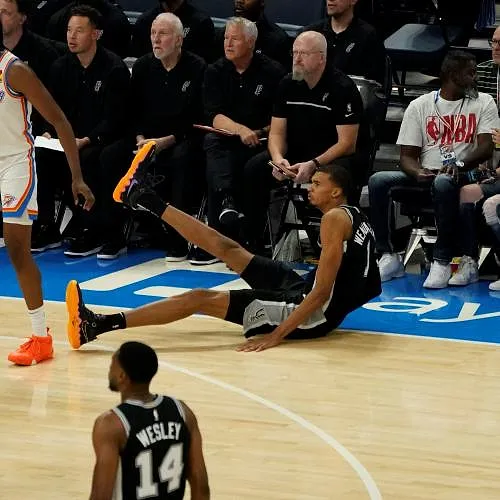 San Antonio Spurs French center #01 Victor Wembanyama falls on the court during the NBA pre-season basketball game between San Antonio Spurs and Oklahoma City Thunder at Paycom Center arena in Oklahoma City, Oklahoma, on October 9, 2023. (Photo by TIMOTHY A. CLARY / AFP)