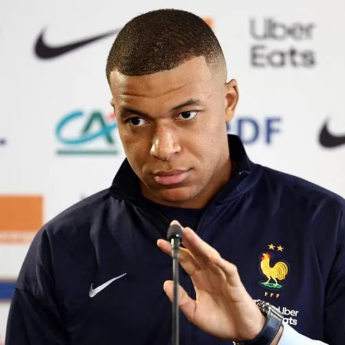 (FILES) France's forward Kylian Mbappe looks on as he speaks during a press conference on the eve of the team's international friendly against Luxembourg, as part of their preparations for the UEFA Euro 2024 European football championships, in Longeville-les-Metz, eastern France, on June 4, 2024. France superstar and captain Kylian Mbappe on June 16, 2024 declared himself "against extremes and divisive ideas" when asked about crucial upcoming legislative elections in the country. (Photo by FRANCK FIFE / AFP)