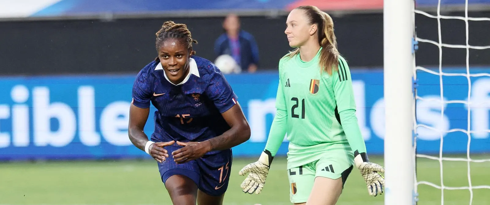 France's forward #15 Kelly Gago (L) celebrates scoring her team's first goal during the women's friendly football match between France and Belgium at the Stade du Hainaut in Valenciennes, northern France, on June 20, 2025. (Photo by FRANCOIS LO PRESTI / AFP)